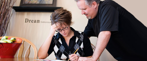 Graphic of a man and a woman reviewing a document