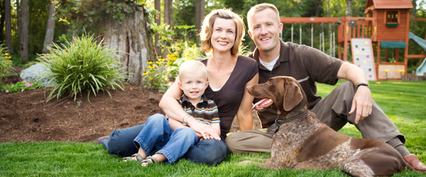 Graphic showing a man, woman, child and a dog sitting on a lawn